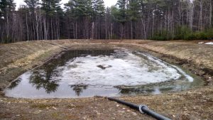 Last of winter's snow melting in lagoon.